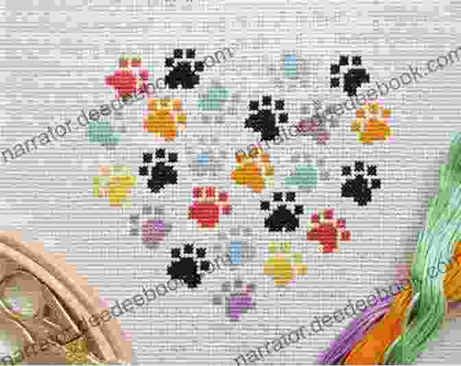 A Close Up Of A Cross Stitch Pattern Featuring A Cat's Paw Print 7 Cats Cross Stitch Patterns Rue Du Chat